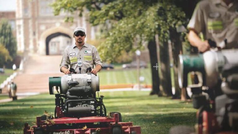 man riding propane powered mower