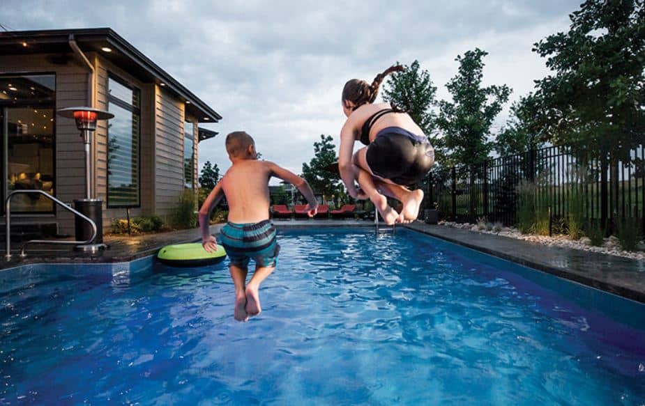 kids jumping into pool