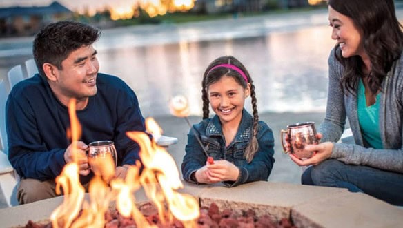 family around fire pit