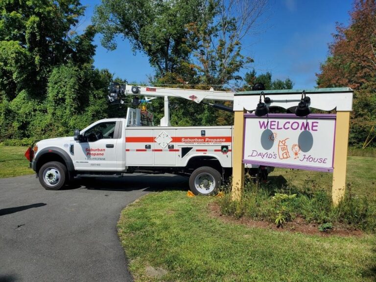 Suburban Propane truck next to David's House sign