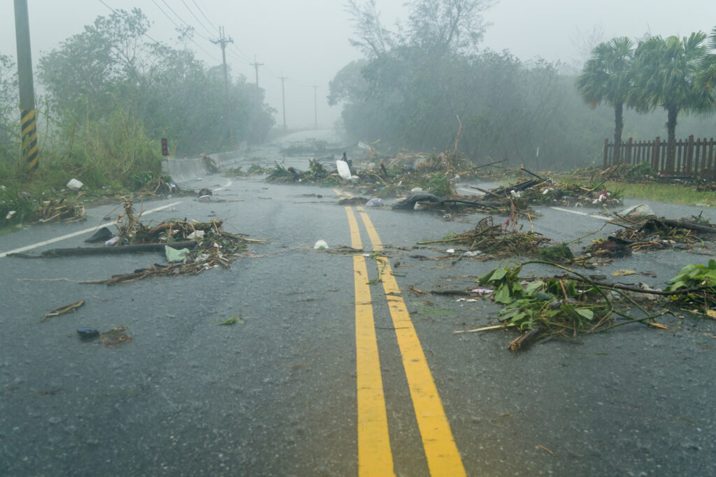 debris blocking a road during a typhoon