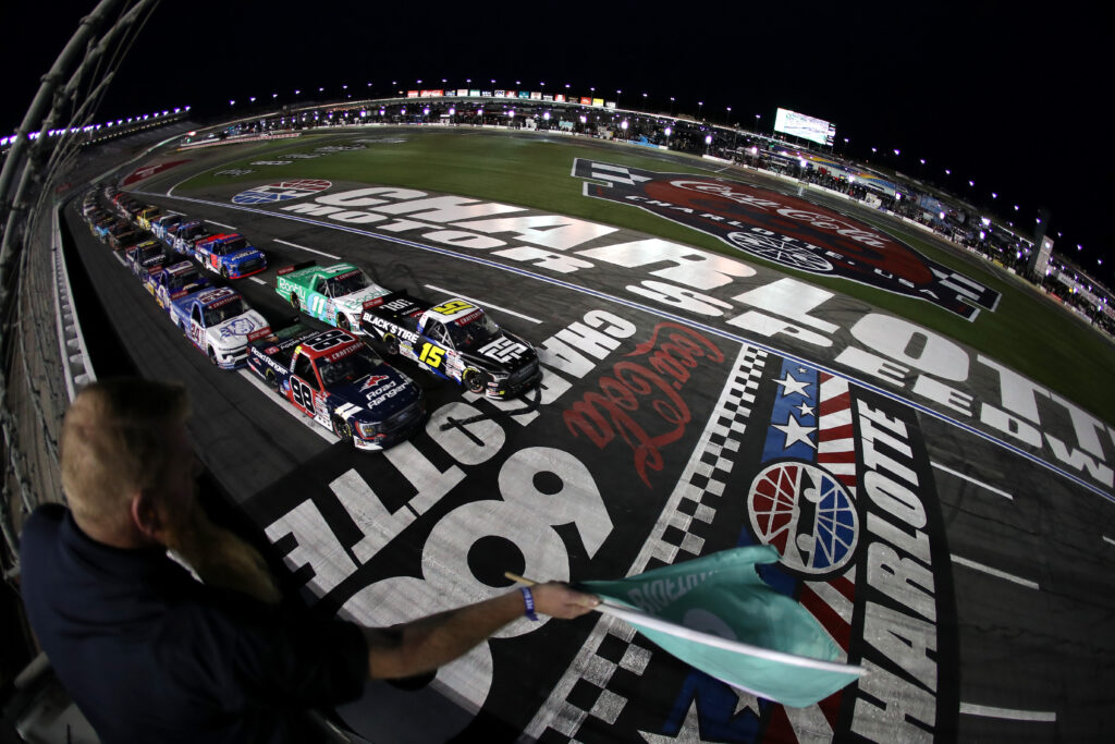 CONCORD, NORTH CAROLINA - MAY 26: Tanner Gray, driver of the #15 Black's Tire Toyota, and Ty Majeski, driver of the #98 Road Ranger Ford, lead the field to the green flag to start the NASCAR Craftsman Truck Series North Carolina Education Lottery 200 at Charlotte Motor Speedway on May 26, 2023 in Concord, North Carolina. (Photo by David Jensen/Getty Images)