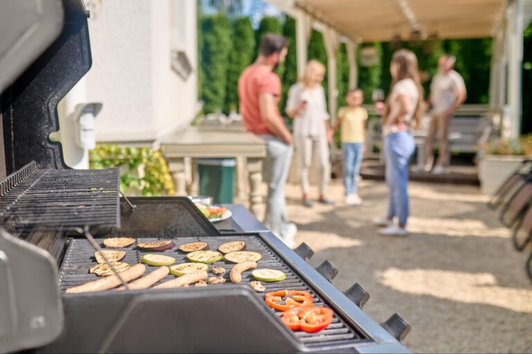 Family grilling on their back patio