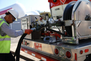 Suburban Propane worker refilling a propane tank